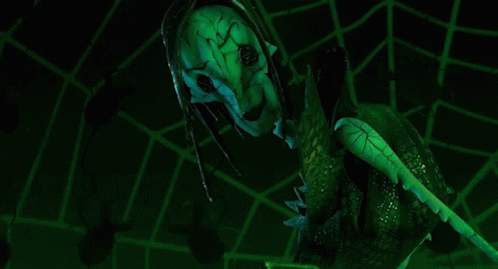 A Green Mask With The Words You 'Re Going To Stay Here Forever GIF