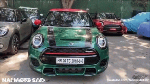 A Green Mini Cooper With A License Plate That Says Hr 26 Tc 2018-8-6 GIF