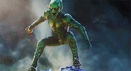 A Green Monster Is Standing On A Blue Object GIF
