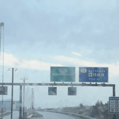 A Green Sign That Says E20 Kobenhavn GIF