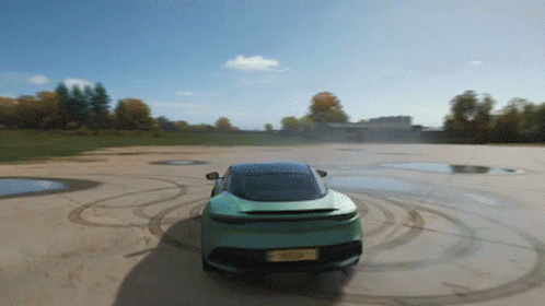 A Green Sports Car With A License Plate That Says ' A ' GIF