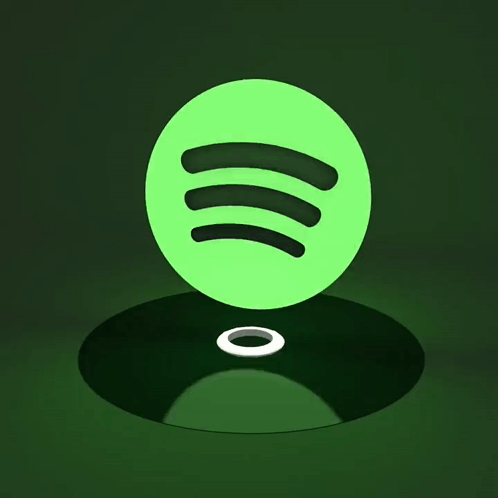 A Green Spotify Logo Sits On A Record GIF