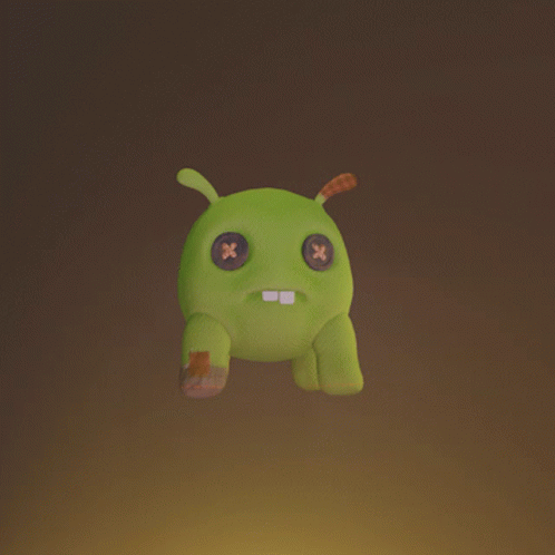 A Green Stuffed Animal With A Leaf On It 'S Back GIF