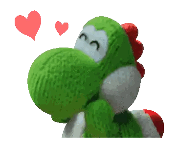 a green stuffed animal with two red hearts around its head