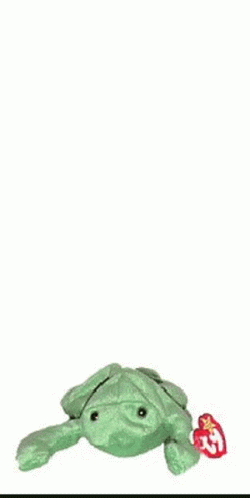 A Green Stuffed Frog With A Tag That Says ' Ty ' On It GIF