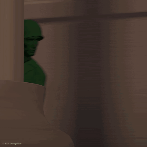 A Green Toy Soldier From Disney Pixar Is Pointing His Gun GIF