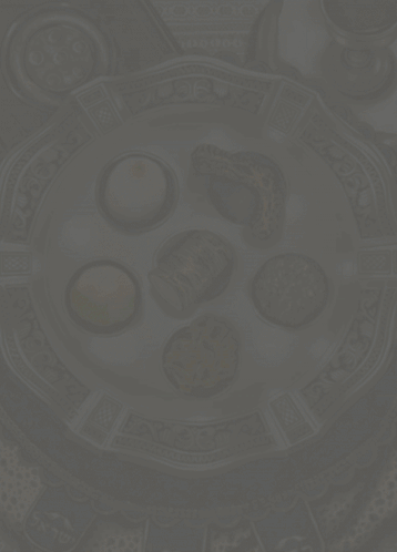 A Greeting Card For Happy Pesagh With A Plate Of Food GIF