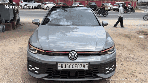 A Grey Volkswagen Car With A License Plate That Says Rj60cf075 GIF