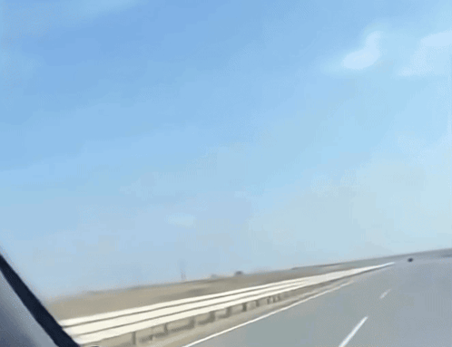 A Grim Reaper Is Holding A Scythe While Riding A Motorcycle GIF