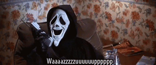 A Grim Reaper Is Sitting On A Couch Talking On A Phone GIF