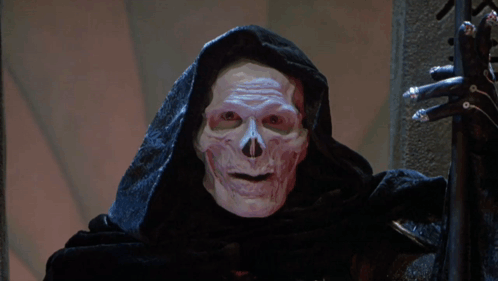A Grim Reaper Wearing A Hood And Holding A Sword Has The Word Mine On His Face GIF