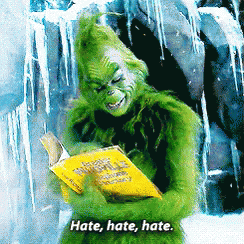 A Grinch Is Reading A Book With The Words Hate Hate Hate GIF