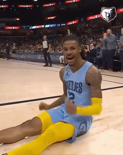A Grizzlies Basketball Player Is Sitting On The Floor GIF