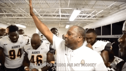 a group of aggies football players are huddled together