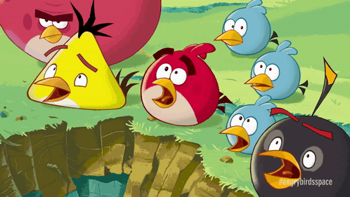 A Group Of Angry Birds Are Standing Next To Each Other In A Field GIF