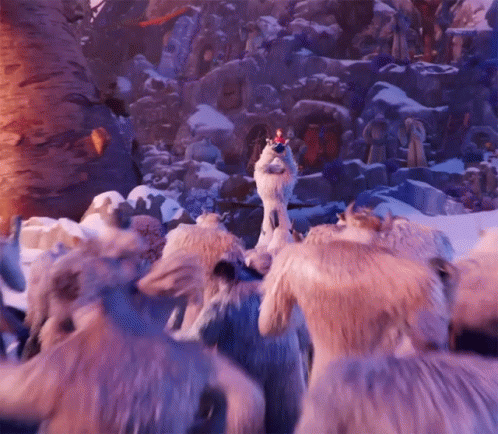 A Group Of Animals Are Standing In The Snow And One Of Them Has A Crown On Its Head . GIF