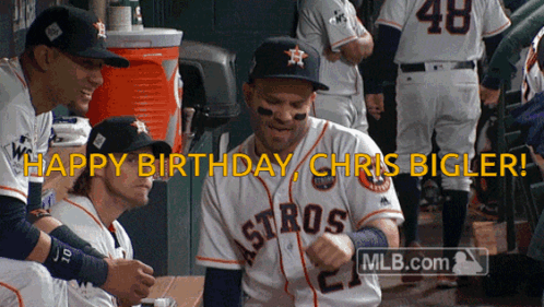 A Group Of Astros Baseball Players Are Celebrating Chris Bigler 'S Birthday In The Dugout GIF