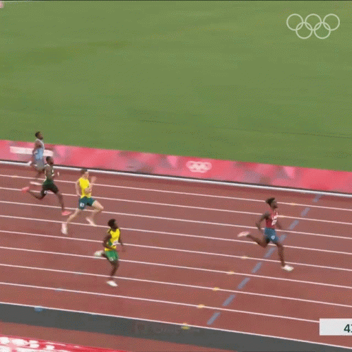 A Group Of Athletes Are Running On A Track With Omega Written On The Side Of The Track GIF