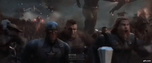 A Group Of Avengers Including Captain America And Thor Are Fighting Each Other GIF