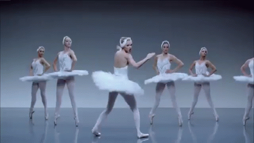 A Group Of Ballerinas Are Dancing In A Row On A Gray Background . GIF