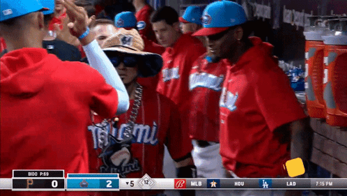 A Group Of Baseball Players Are Standing In A Dugout With A Scoreboard That Says Mlb At The Top GIF