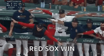A Group Of Baseball Players Are Standing In A Dugout With Their Arms Outstretched . GIF