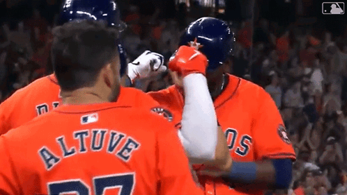 A Group Of Baseball Players Are Standing Next To Each Other And One Of Them Has The Name Altuve On His Back . GIF