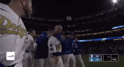 A Group Of Baseball Players Are Standing On A Field With A Scoreboard That Says Det 5 Lad 8 GIF