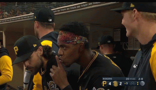 A Group Of Baseball Players In A Dugout With Rogers On The Scoreboard GIF