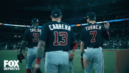 A Group Of Baseball Players Including Carrera Number 13 And Turner Number 7 Walk Off The Field GIF