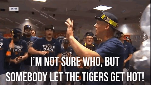 A Group Of Baseball Players Wearing October Ready Shirts Are Gathered In A Room GIF