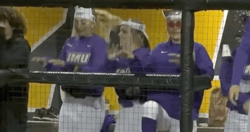 a group of baseball players wearing purple shirts with imu on them