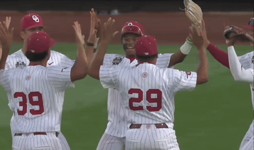 A Group Of Baseball Players With The Number 39 And 29 On Their Uniforms GIF