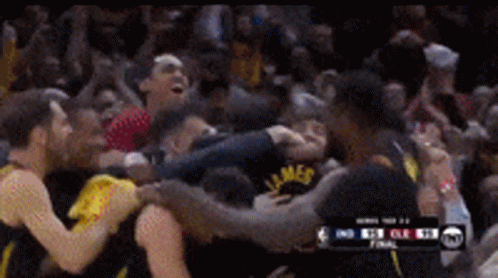 a group of basketball players are huddled together and one has the word james on his shirt