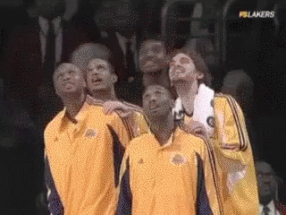 A Group Of Basketball Players Are Looking Up At The Sky GIF