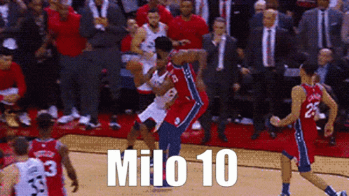 A Group Of Basketball Players Are Playing A Game And One Of Them Has The Number 10 On His Jersey GIF