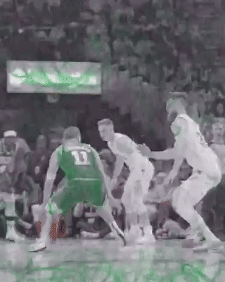 A Group Of Basketball Players Are Playing A Game Of Basketball . GIF