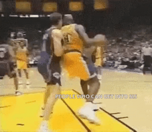 A Group Of Basketball Players Are Playing A Game Of Basketball And One Of Them Is Wearing A Number 13 Jersey . GIF