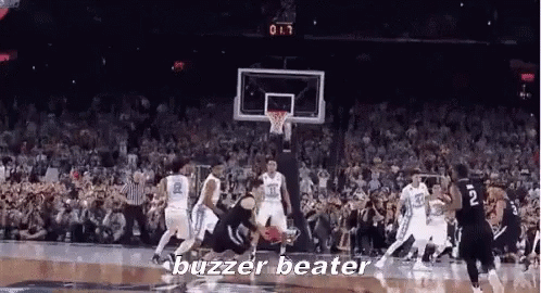 A Group Of Basketball Players Are Playing A Game Of Basketball And The Words Buzzer Beater Are On The Screen . GIF