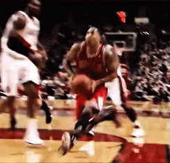 A Group Of Basketball Players Are Playing A Game Of Basketball On A Court GIF