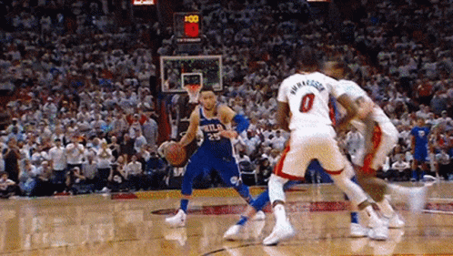 A Group Of Basketball Players Are Playing A Game Of Basketball . GIF