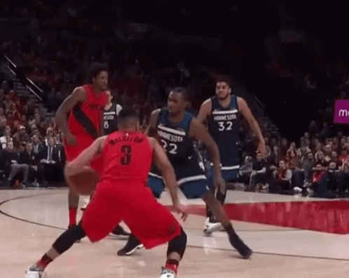 A Group Of Basketball Players Are Playing A Game On A Court . One Of The Players Has The Number 3 On His Jersey . GIF