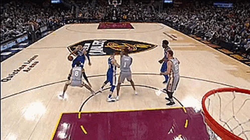 A Group Of Basketball Players Are Playing A Game On A Court That Says Queens Lawn Arena GIF
