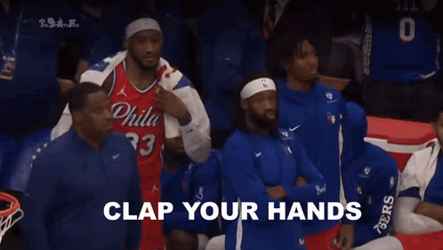 A Group Of Basketball Players Are Sitting In The Stands With The Words " For Philadelphia " Written In White GIF