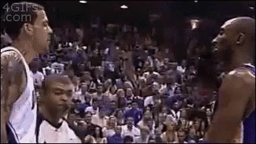 A Group Of Basketball Players Are Standing Next To Each Other On A Court . GIF