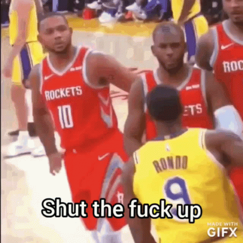 A Group Of Basketball Players Are Standing On A Court And One Of Them Is Talking To Another Player . GIF