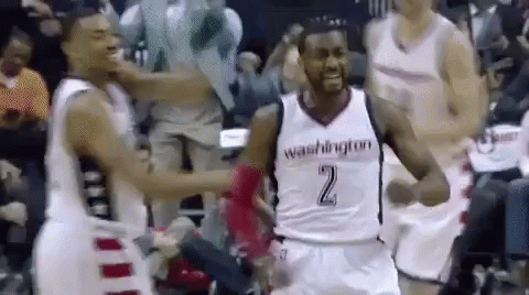 A Group Of Basketball Players Are Standing On A Court And One Of Them Is Wearing A Number 2 Jersey . GIF