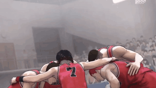 A Group Of Basketball Players Huddled Together With The Number 7 On The Back Of Their Jersey GIF
