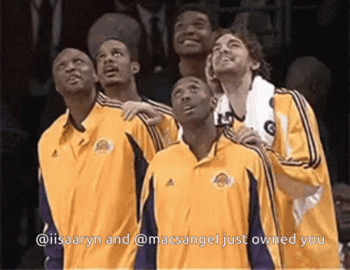A Group Of Basketball Players Looking Up With The Caption @Iisaaryn And @Macsangel Just Owned You GIF