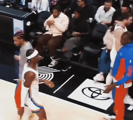 A Group Of Basketball Players Standing On A Court With A Toyota Logo On The Floor GIF